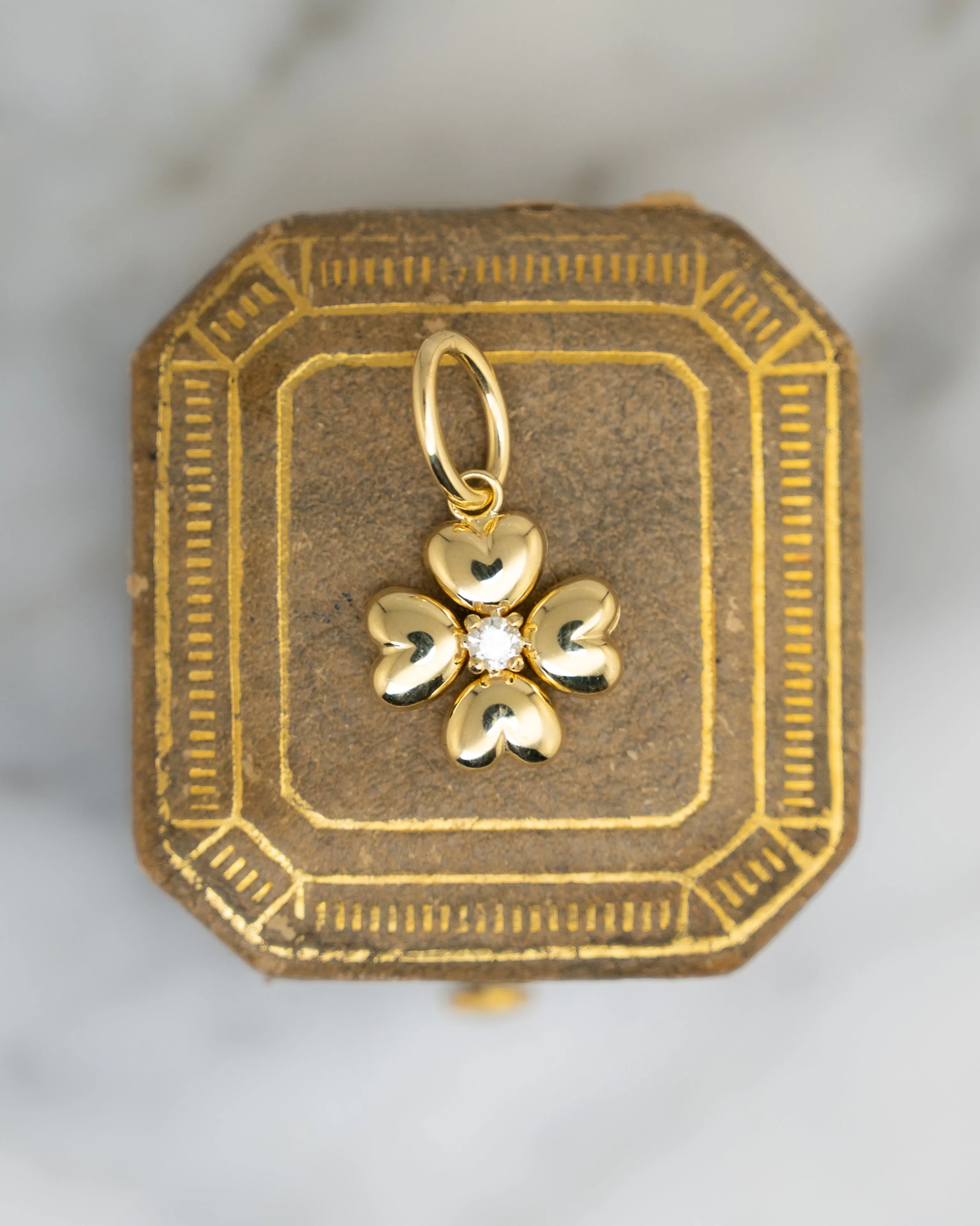 .06 Puffy Four Leaf Clover Charm in 14k Yellow Gold