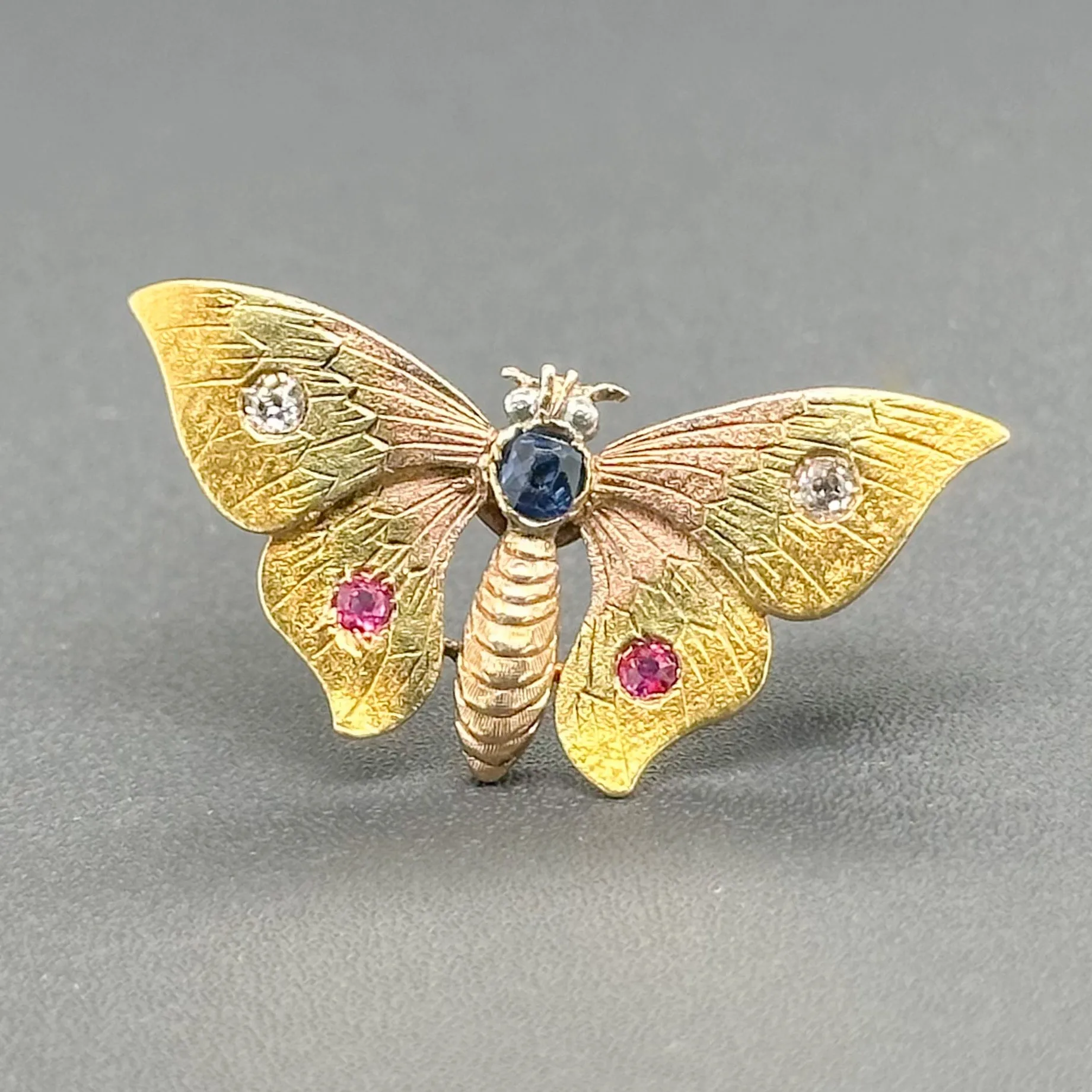 Estate 13K Tri-Color Gold 0.06cttw Ruby. 0.09ct Sapphire. 0.06cttw H-I/SI1 Diamond Butterfly Pin